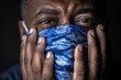 © Vlad - Health Disparity: African American Man in Blue and White Surgical Face Mask during Epidemic
