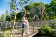 © pacoocimage - Future parents embracing on bridge anticipating new life