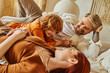 © LIGHTFIELD STUDIOS - Joyful moments of family love in a cozy home filled with laughter and warmth
