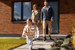 © Maria Vitkovska - Happy family leaving modern house for school day