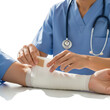© CreativeVista - Nurse applying bandage to patient arm isolated on transparent background
