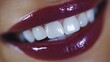© Thanayut - close-up of smiling lips with bright white teeth and glossy dark lipstick