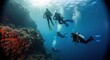 © DNY3D - Cinematic underwater vista of scuba divers gracefully descending near a rugged cliff face