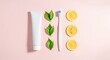 © MONIRANI - Flat lay of toothpaste, toothbrush, green leaves, and lemon slices on a pink background