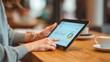 © spyrakot - Teen Girl Using Budgeting App on Tablet with Parental Guidance for Financial Literacy
