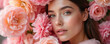 © Maryna - Close up photo of young woman in pink flowers. Girl has soft skin makeup and looks into camera. Beauty floral concept for shop banner or salon ad.