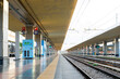© valbar STUDIO/Stocksy - Train Station Platform With Empty Tracks