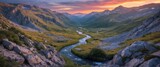 Serene Valley Landscape with Flowing River Under Dramatic Sunset Sky and Majestic Mountains in Background