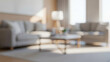 © birulaut - Blurry modern living room interior with soft light and neutral furniture, expressing a peaceful cozy home mood filled with natural illumination, warmth, and relaxed design balance.
