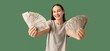 © Pixel-Shot - Happy woman with money on green background