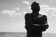© Ivan Andrianov/Stocksy - Emotional Man Embracing Solitude by the Sea Under a Clear Sky