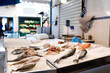 © Jimena Roquero/Stocksy - Fish shack in street market in Greek Island