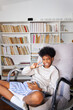 © Studio Firma/Stocksy - Boy in chair