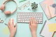 © Pixel-Shot - Female hands with computer keyboard, mouse and office stationery on turquoise background
