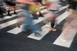 © koganami studio/Stocksy - Crowd crossing urban street on zebra lines