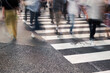 © koganami studio/Stocksy - Crowd crossing urban street on zebra lines