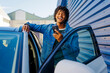 © BONNINSTUDIO/Stocksy - Man using smartphone laughing by car