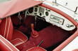 © Maryna Shtukina/Stocksy - Red Vintage Car Interior