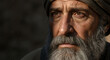 © ON - Studio - A wise elderly man with a gray beard in a dramatic close-up portrait. Pensive senior with a thoughtful gaze representing a biblical prophet or historical character