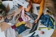 © TrueShot | Westend61 - Hands of fashion designer sewing clothes on machine at table