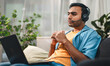 © dodotone - Indian man wearing headset serious thinking sloving problem customer service online technical support
