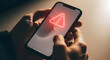 © Lucianastudio - Human hands holding a smartphone with a red triangle warning sign on the screen indicating potential issues such as security threats or network problems requires user action for