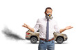 © Ljupco Smokovski - Disappointed man wearing a gas mask in front of a vehicle with exhaust fumes