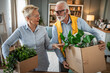 © Migma_Agency - Senior couple moving, unpacking boxes in new home