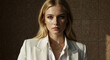 © Milan - Confident professional businesswoman with blonde hair looking at the camera. Close-up portrait of an elegant young woman in a white blazer. Modern corporate old money aesthetics headshot
