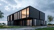 © phetsavun - A modern, minimalist building featuring a sleek design with large windows and a dark exterior, set against a cloudy sky and grassy landscape.