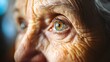 © Crafted - Close-up of an elderly woman's eye looking off to the side, with wrinkles around the eye.
