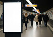 © smth.design - Blank advertising billboard in busy underground subway station with commuters walking past illuminated display panel