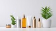 © Matcha_09 - Elegant Arrangement of Skincare and Cosmetic Bottles on a Minimalist White Background with Fresh Green Plant Accents for Wellness and Beauty Concepts
