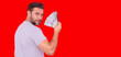 © Volodymyr - Portrait business man holding cash dollar bills over red studio background. Big luck, banner. Dollar cash money concept. Rejoices to win cash. Man hold cash money. Financial luck and success.