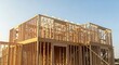 © PixelPlusCreative - New residential construction framing with blue sky, showcasing the early stages of building a modern home and real estate development