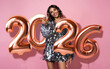 © opolja - Happy New Year 2026 to you. One young and beautiful woman in sparkle dress dancing with glass of champagne and smiling