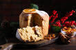 © New Africa - Christmas food. Delicious Panettone cake and festive decor on wooden table, closeup