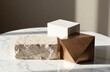 © starush - Minimalist arrangement of geometric blocks on marble surface with natural lighting