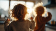 © Olha Havelia - clouse up A soft-focus shot of siblings having fun in a kitchen, faceless silhouettes laughing and dancing, warm morning tones, with copy space