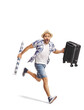 © Ljupco Smokovski - Excited male tourist running and carrying a suitcase and beach umbrella