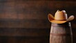 © pvl0707 - Charming cowboy hat resting atop a rustic barrel against a warm wooden backdrop evoking Wild West nostalgia