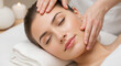 © NeuroCake - Woman receiving a relaxing facial massage in a beauty spa. Professional esthetician performing a skincare treatment for rejuvenation. Cosmetology and wellness concept