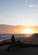 © Camila - Woman watching the sunset, Colonia, Uruguay