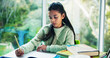 © peopleimages.com - Education, homework and notebook with girl student at desk n home for development or learning. Growth, school study and writing with child learner in apartment for assessment, knowledge or solution