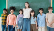 © paulaphoto - Smiling teacher and diverse group of children standing in front of chalkboard, raising their hands together in joy celebration. Back to school, education.
