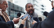 © Malik25/peopleimages.com - Man, politician and discussion with journalists, city and press with election questions and talking. Outdoor, interview and minister with reporters for campaign update, media and people with mic