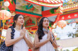 © crizzystudio - Young asian women praying at traditional chinese temple