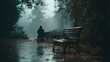 © Pavel - Sadness envelops a man sitting alone on a park bench under gray skies during a rainy autumn day in a quiet, abandoned area of the city