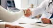 © Lawrenson25/peopleimages.com - Closeup, handshake and doctor in office, patient and greeting with thank you, appointment or recovery. Shaking hands, people and medical service with checkup, consultation and introduction in clinic