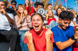 © unai - Young excited multi ethnic fans cheering at stadium